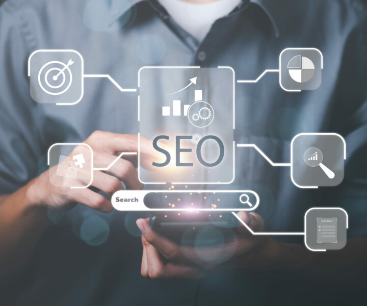 Marketer showing SEO concept through virtual icons , optimization analysis tools, search engine rankings, social media sites based on results analysis data ,Website rankings for best results
